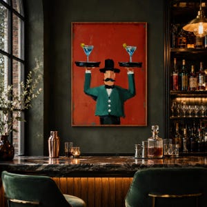 May include: A framed wall art print featuring a stylised painting of a mustachioed figure in a black top hat and green jacket, holding two black trays with blue cocktails against a solid red background, displayed in a dimly lit bar setting.