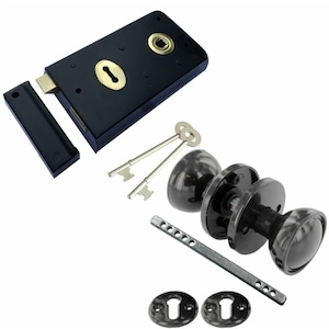 May include: Black door knob set with two keys, a latch, and two escutcheons. The set includes a black door handle with a round knob and a black backplate.