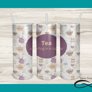 May include: A sublimation design for a 20 ounce skinny tumbler featuring a white background with a pattern of teacups and teapots. The text "Tea a hug in a cup" is written in a purple circle on the middle tumbler.