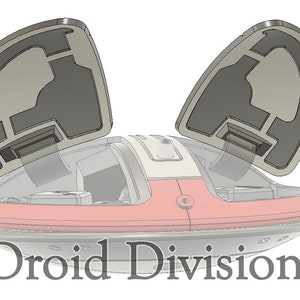 May include: A red and white model of a futuristic vehicle with two grey, hinged doors open. The vehicle has a round, flat base and a dome-shaped top. The text "Droid Division" is printed below the vehicle.