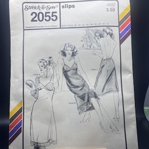 May include: Vintage sewing pattern for slips, featuring illustrations of three different slip designs. The pattern is labeled "Stretch & Sew slips 2055" and includes bust sizes from 28 to 44 inches. The cover has a retro design with a color stripe.