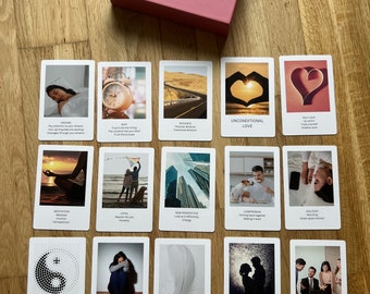 May include: A set of 16 love oracle cards with colorful images and text. The cards are laid out in four rows of four cards each. The cards feature images of a heart, a clock, a road, a couple, a feather, a yin yang symbol, a person meditating, a person crying, a person holding a kite, a person holding a dog, a person holding a phone, a person holding a book, a person holding a cup, and a person holding a pen. The text on the cards includes words like "love", "distance", "unconditional love", "new perspective", "compromise", "jealousy", "karma", "forgiveness", "signs", "reconciliation", and "extroverted".
