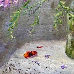 May include: An impressionistic painting of a floral still life. The artwork features vibrant purple and pink flowers with green stems in a clear glass vase. Scattered petals and a red-orange object rest on a white surface.