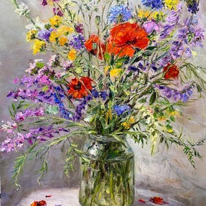 May include: A vibrant oil painting of a wildflower bouquet in a clear glass jar. The arrangement features red poppies, purple, yellow, and blue wildflowers. The jar sits on a white lace-covered surface against a gray backdrop. The artist's signature is visible.