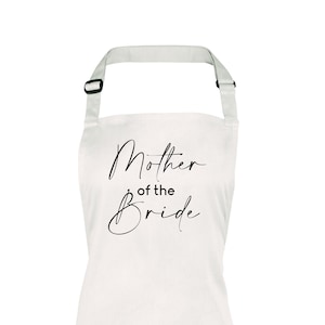 May include: White apron with black text that reads "Mother of the Bride".