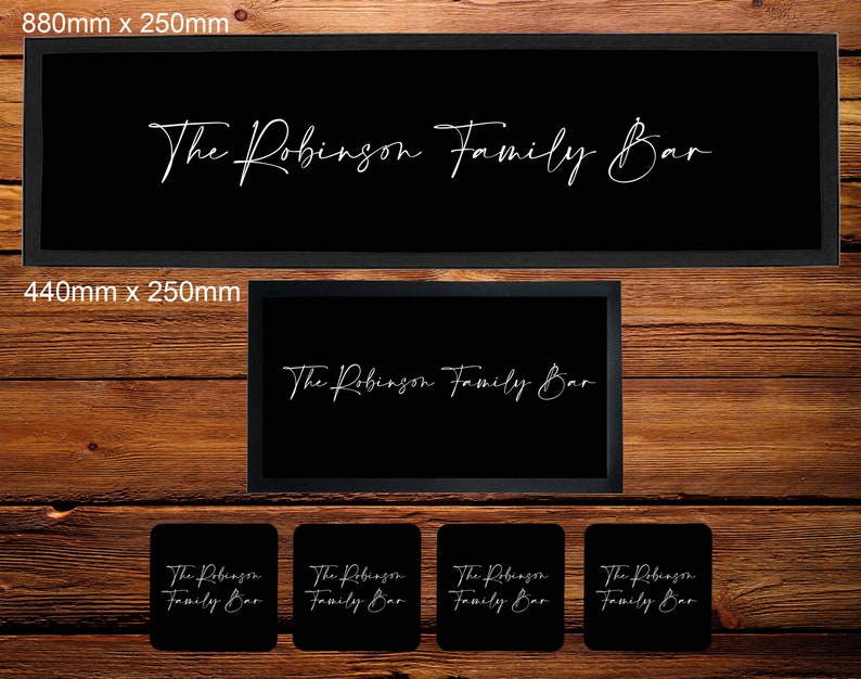 May include: A set of bar signs with the text "The Robinson Family Bar" in white script on a black background. The signs are available in three sizes: 880mm x 250mm, 440mm x 250mm, and 100mm x 100mm.