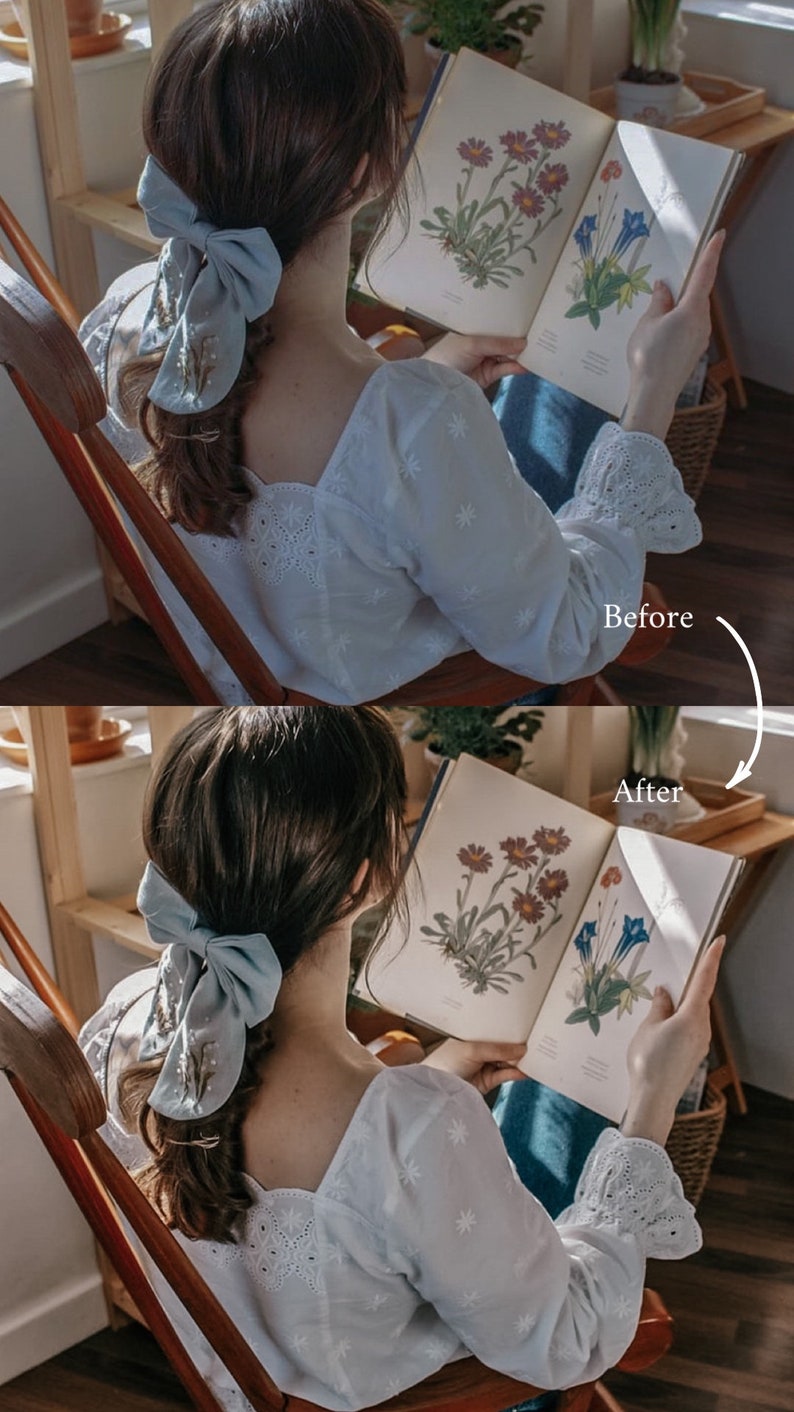 May include: A woman wearing a white blouse with embroidered details sits in a wooden chair and reads a book with botanical illustrations. She has a light blue bow in her hair.