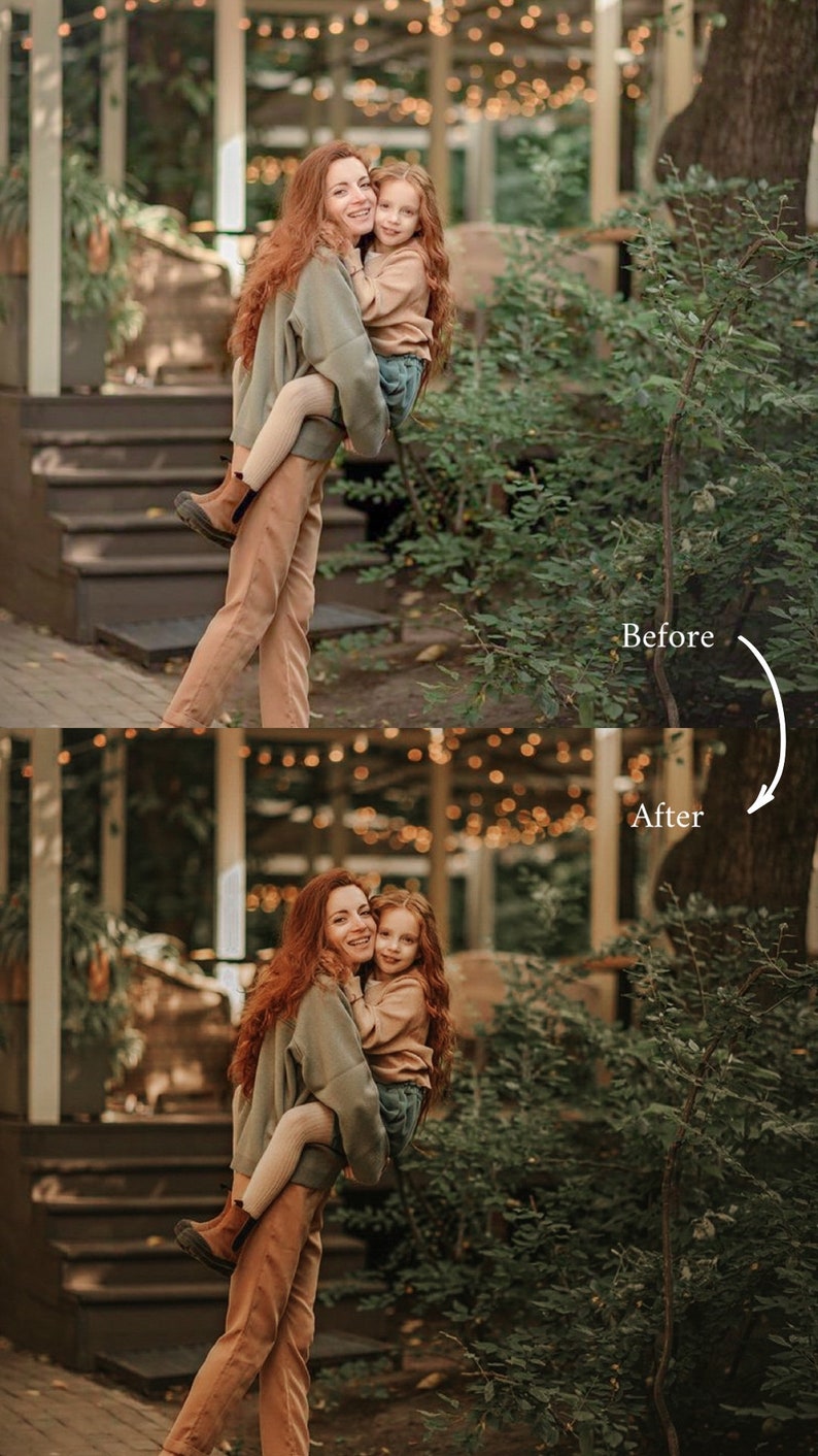 May include: A woman and a young girl are standing in front of a green bush. The woman is holding the girl in her arms. They are both smiling and looking at the camera. The woman is wearing a green sweater and brown pants. The girl is wearing a beige sweater and blue jeans.