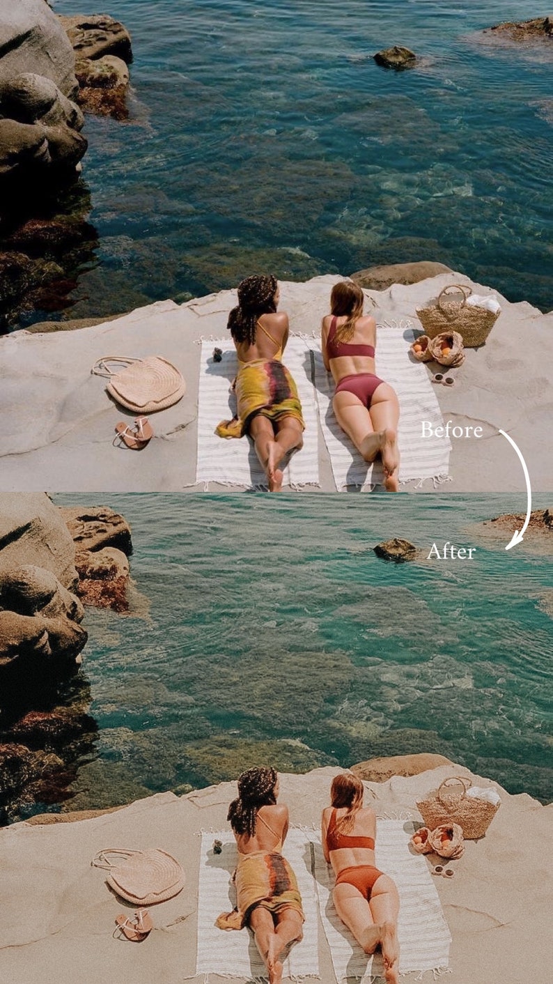 May include: Two people in swimsuits are laying on towels on a sandy beach. The beach is next to a body of water. There is a wicker basket with fruit in it.