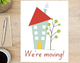 May include: A white card with a cartoon illustration of a blue house with a red roof and a green tree. The text "We're moving!" is written in red below the house.