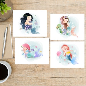 May include: Set of four printable illustrations featuring mermaids with colorful tails and flowers. Each mermaid is depicted with a different expression and holding a sea creature.