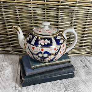 Bule de chá vintage decorativo floral e padrão de folhas com detalhes dourados Bule Dean Tunstall Cobalto e laranja
