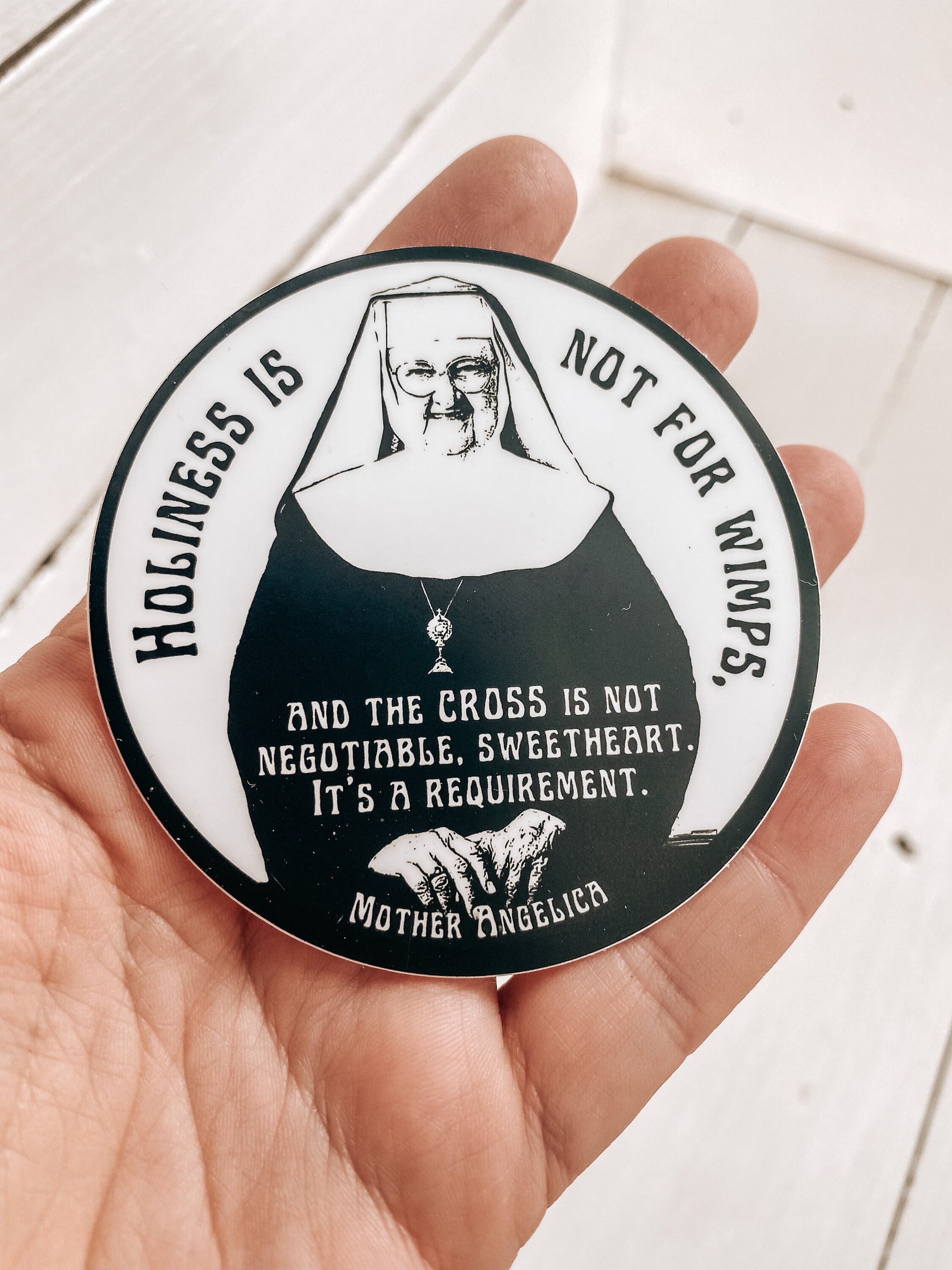 Mother Angelica quote, &quot;Holiness is not for wimps and the cross is not negotiable, sweetheart, it&#39;s a requirement.”| Circle Catholic sticker