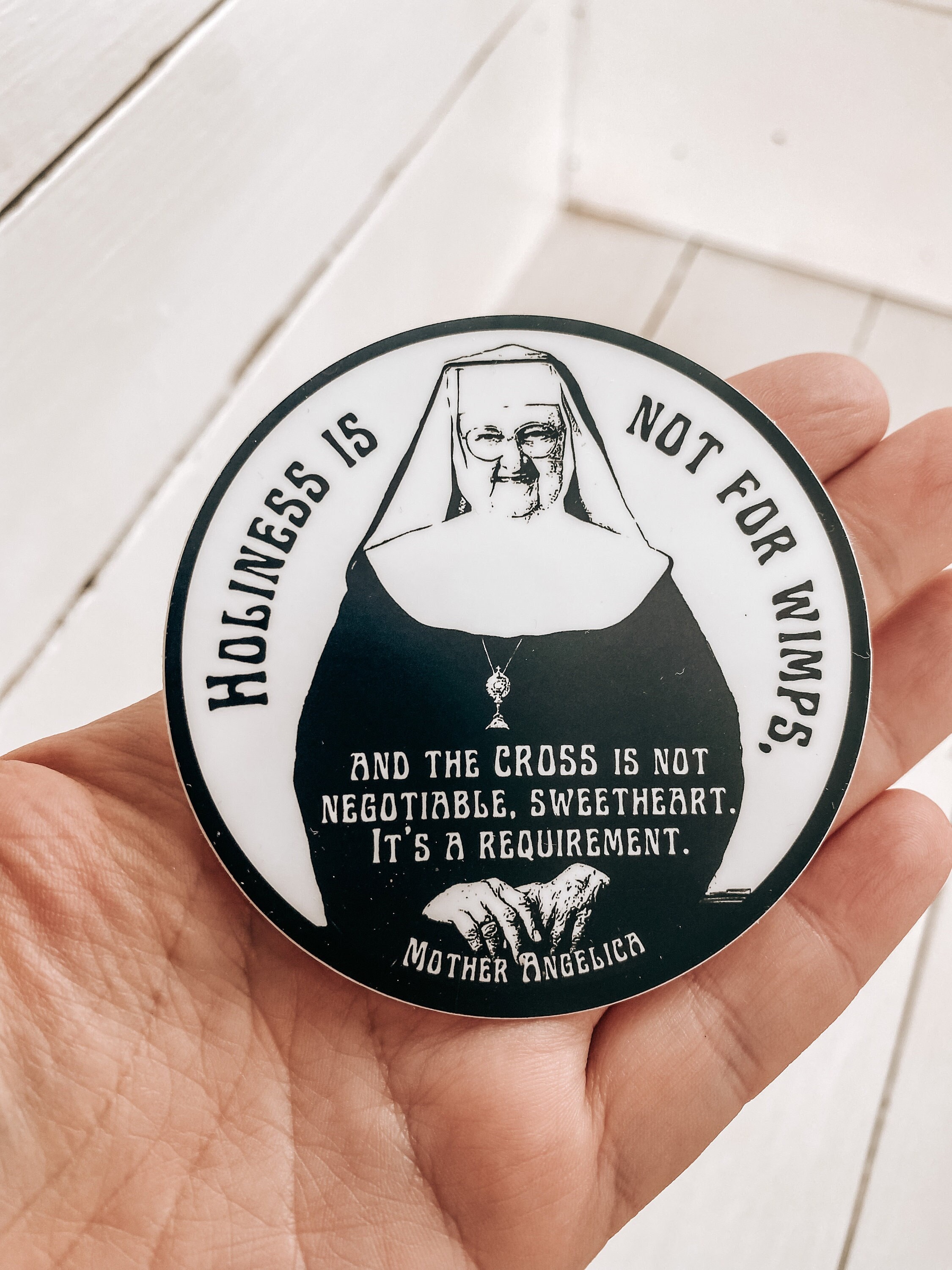 Mother Angelica quote, &quot;Holiness is not for wimps and the cross is not negotiable, sweetheart, it&#39;s a requirement.”| Circle Catholic sticker