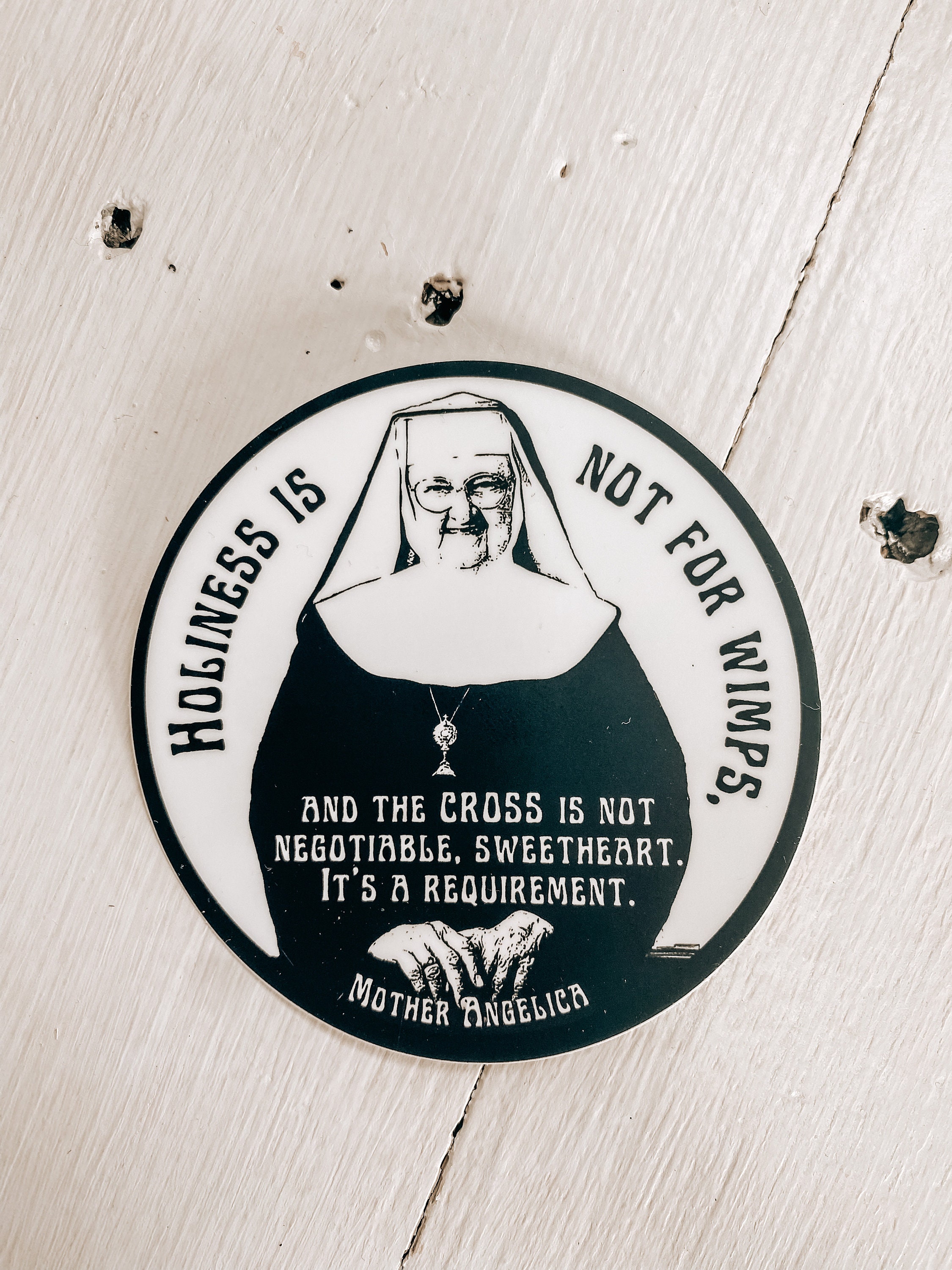 Mother Angelica quote, &quot;Holiness is not for wimps and the cross is not negotiable, sweetheart, it&#39;s a requirement.”| Circle Catholic sticker