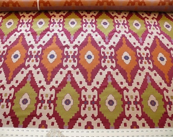 May include: A close-up of a fabric with a repeating geometric pattern in shades of red, orange, green, and white. The pattern is reminiscent of an ikat design.