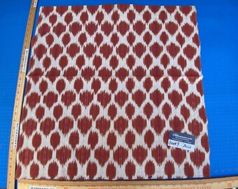 May include: A close-up of a fabric sample with a white background and a brown and pink geometric pattern. The fabric is labelled "Berk 9 Print".