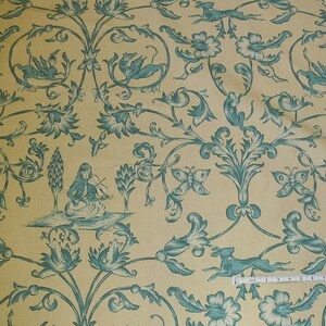 May include: A yellow fabric with a repeating pattern of blue stylized flowers, butterflies, and birds. The pattern is reminiscent of a traditional wallpaper design.