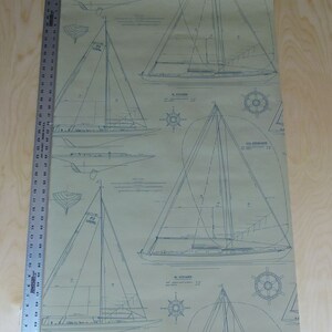 May include: A vintage style wallpaper featuring blue line drawings of sailboats on a beige background. The wallpaper features the names of the sailboats, "FJ LUGER", "SL VOYAGER", and "CCA SPINNAKER".