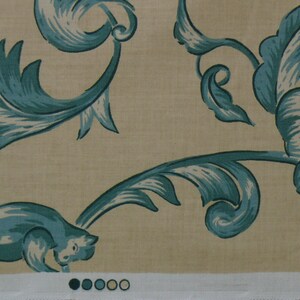 May include: A beige fabric with a blue floral pattern. The pattern features stylized leaves and flowers. The fabric has a subtle texture and a soft, natural feel.