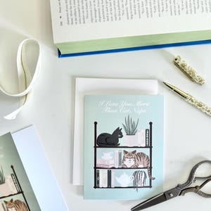 Cartão de Dia do Amor com tema de gato e livro, ilustração em tinta em cores pastel, cartão de Dia dos Namorados, cartão de aniversário, cartão de felicitações de gato fofo.
