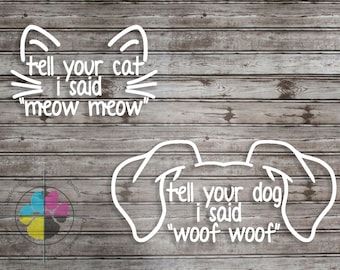 May include: White outline of a cat's face with the text "Tell your cat I said "meow meow"" and a white outline of a dog's face with the text "Tell your dog I said "woof woof"" on a wood background.