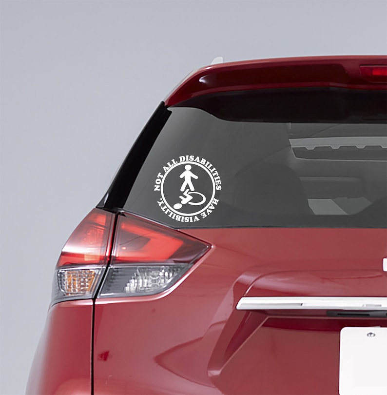 May include: White vinyl sticker on a red car. The sticker is a circle with the text "Not All Disabilities Have Visibility" and a stick figure icon of a person with a disability.