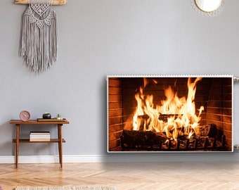 May include: A white electric fireplace with a realistic flame effect. The fireplace is mounted on a wall and has a modern design. The fireplace is surrounded by a light gray wall, a wooden floor, and a small table with a clock and a plant.