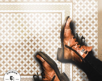 May include: A pair of brown leather boots with laces and zippers are placed on a patterned floor tile. The tile is a light brown color with a white geometric pattern. The tile is surrounded by a border of a darker brown color. The text "CHINUA FLOORING" is visible in a circle on the bottom left corner of the image.