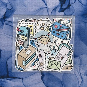 May include: A clear plastic bag filled with colorful stickers featuring cartoon mailboxes, envelopes, and a sun with a cloud. The stickers have a whimsical and cute design.
