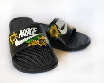 white nike slides with sunflowers