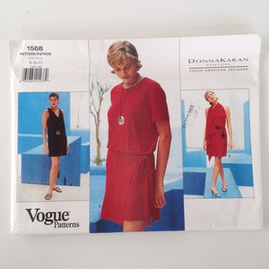 May include: A sewing pattern for a red wrap dress with short sleeves. The pattern is from Vogue Patterns and is designed by Donna Karan. The pattern number is 1568 and the size is 8-10-12.