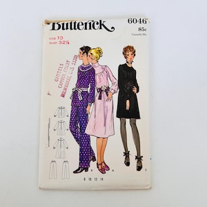 Op de afbeelding: Een Butterick 6046 naaipatroon-envelop voor maat 10, buste 32,5 inch. De voorzijde toont illustraties van drie outfits: een paarse tuniek met stippen en broek, een lichtroze jurk met ceintuur en een zwarte jurk met lange mouwen.
