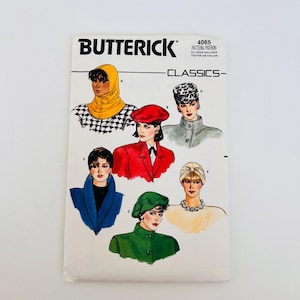 May include: A Butterick 4065 Classics sewing pattern envelope featuring illustrations of various headwear styles including a yellow hood, a red beret, a leopard print hat, a green cap, and a cream-colored turban, all displayed on a white background.
