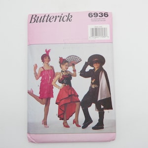 May include: A vintage sewing pattern for three costumes: a flapper dress, a Spanish dancer dress, and a Zorro costume. The pattern number is 6936. The pattern is from the brand Butterick.