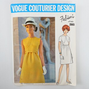 May include: Vogue Couturier Design sewing pattern featuring a yellow dress with a matching jacket. The pattern includes a photo of a model wearing the dress and a line drawing of the design. The text "Fabiani of Italy 2065" is also visible.