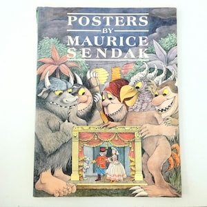 May include: A vintage book cover titled "Posters by Maurice Sendak" featuring illustrations of whimsical monsters and a small stage with costumed characters. The cover has a watercolor style with a blue and green background.