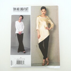 May include: A Vogue Patterns sewing pattern featuring designs by Tom and Linda Platt. The pattern includes images of a white top and black pants, and a gold-colored top with black pants. The pattern size range is 16-18-20-22-24.