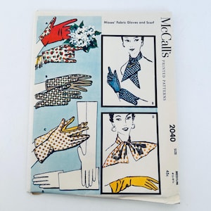May include: Vintage McCall's printed pattern 2040 showing fabric gloves and scarves. The gloves are illustrated in various designs, including red with white polka dots, and yellow with brown polka dots. The pattern size is medium, 16.5-17.8 cm.