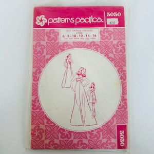 May include: A Patterns Pacifica sewing pattern envelope, model 3030, featuring a pink and white floral background. The front displays a circular illustration of three dress styles and text indicating it contains sizes 6, 8, 10, 12, 14, and 16.