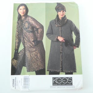 May include: Sewing pattern by Vogue American Designer featuring two long coats. One is a metallic gold quilted design with black accents and pearl trim. The other is a grey quilted coat with a matching hat and scarf.
