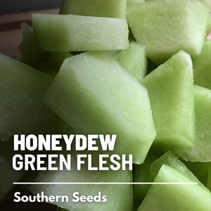 May include: Close-up of cubed green honeydew melon. The melon is light green and has a smooth texture. The text "HONEYDEW GREEN FLESH" and "Southern Seeds" is visible in the image.