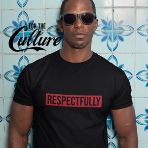 May include: Black t-shirt with the word "RESPECTFULLY" in red block letters. The phrase "FOR THE Culture" is printed in black script on the upper left. The person in the image is wearing black sunglasses.