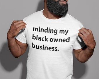 Minding my black owned business Unisex T-Shirt
