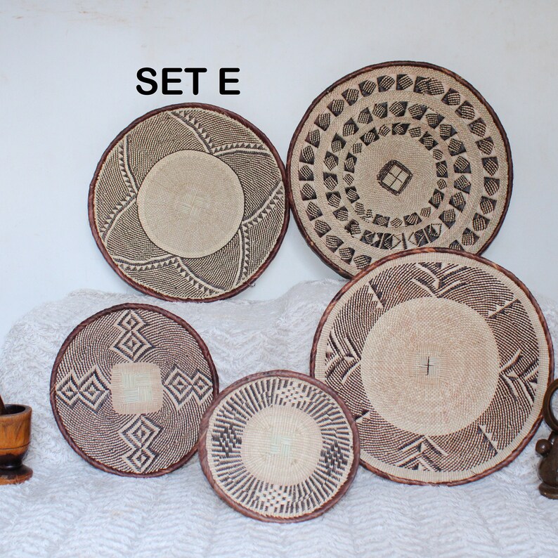 A group of five Handmade African Wall baskets called Binga baskets or Tonga baskets. They are used as boho woven wall hangings.