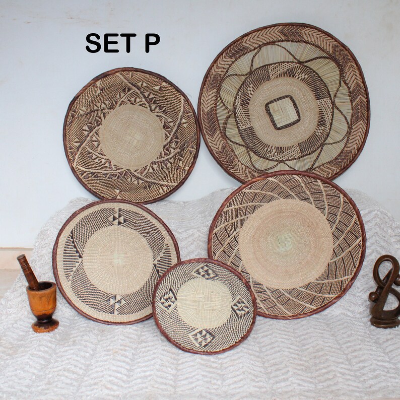 A group of five Handmade African Wall baskets called Binga baskets or Tonga baskets. They are used as boho woven wall hangings.