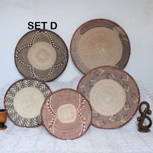 A group of five Handmade African Wall baskets called Binga baskets or Tonga baskets. They are used as boho woven wall hangings.