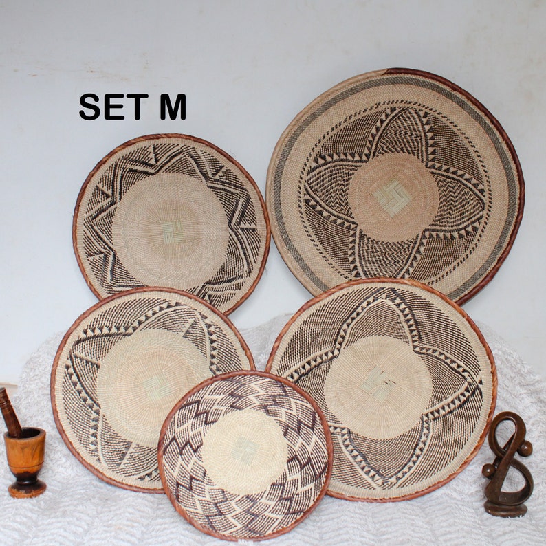 A group of five Handmade African Wall baskets called Binga baskets or Tonga baskets. They are used as boho woven wall hangings.