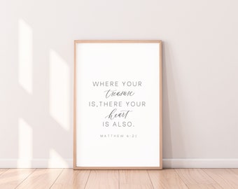 May include: A framed print with a white background and black text that reads "Where your treasure is, there your heart is also. Matthew 6:21".