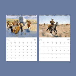Two open calendar pages show May and June 2027; May features cowboys and cattle crossing a river, and June shows a cowboy on a galloping horse.